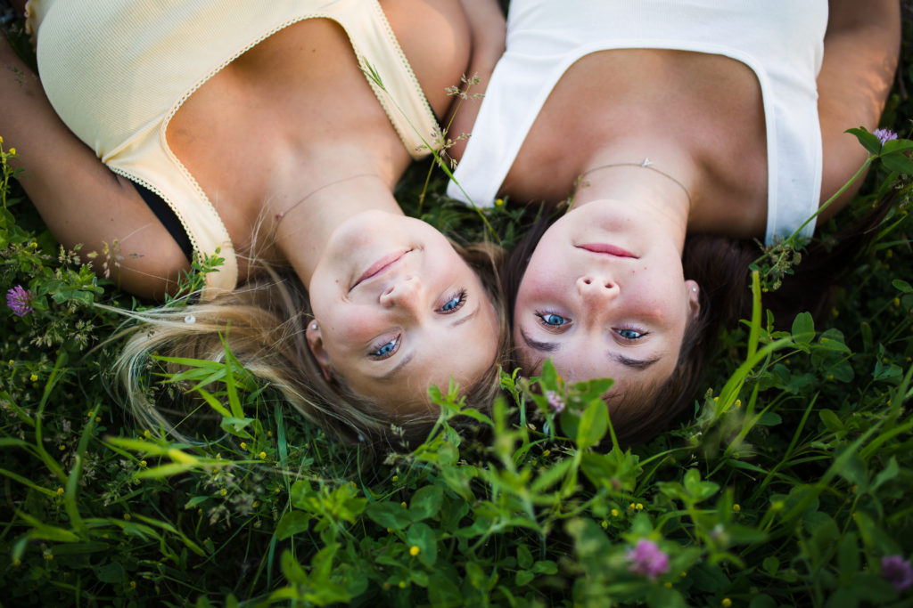 Girls laying in wildflowers